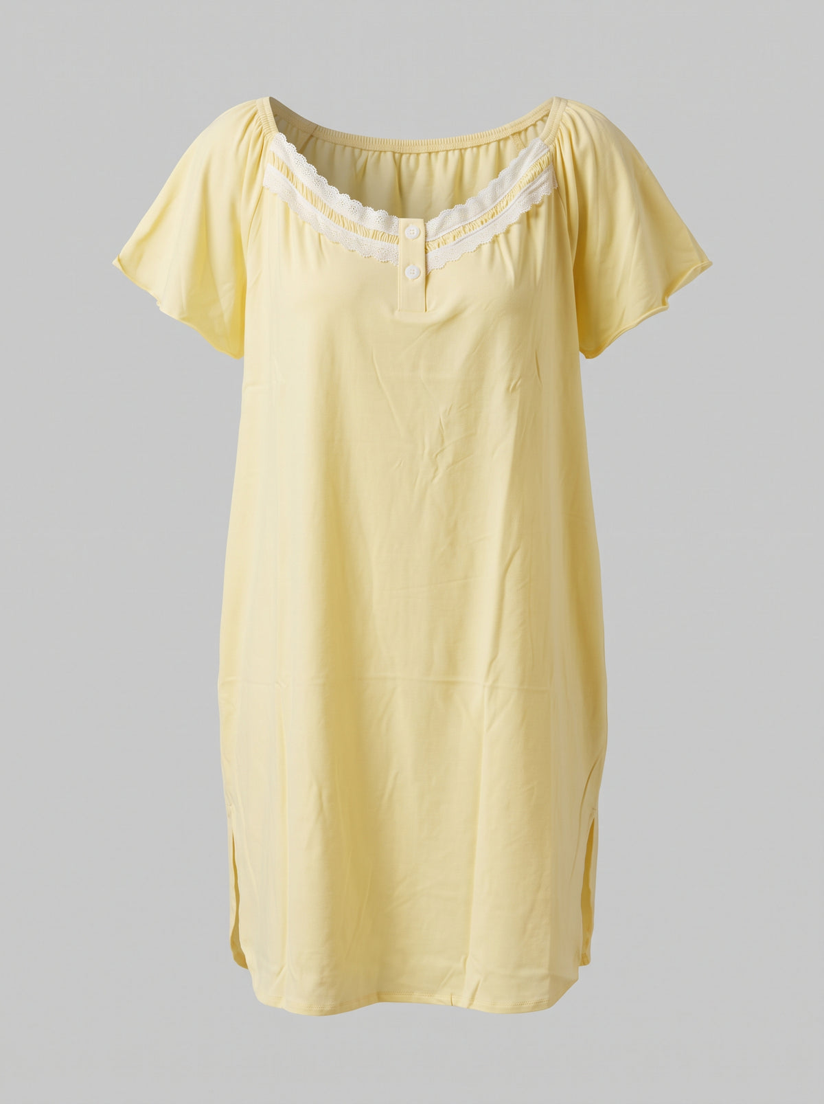 A pale yellow short-sleeve nightgown with a scoop neckline and white lace trim, displayed against a solid gray background.